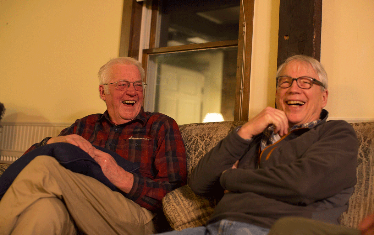 Phil Crossman, left, shares a laugh with a fellow club member.